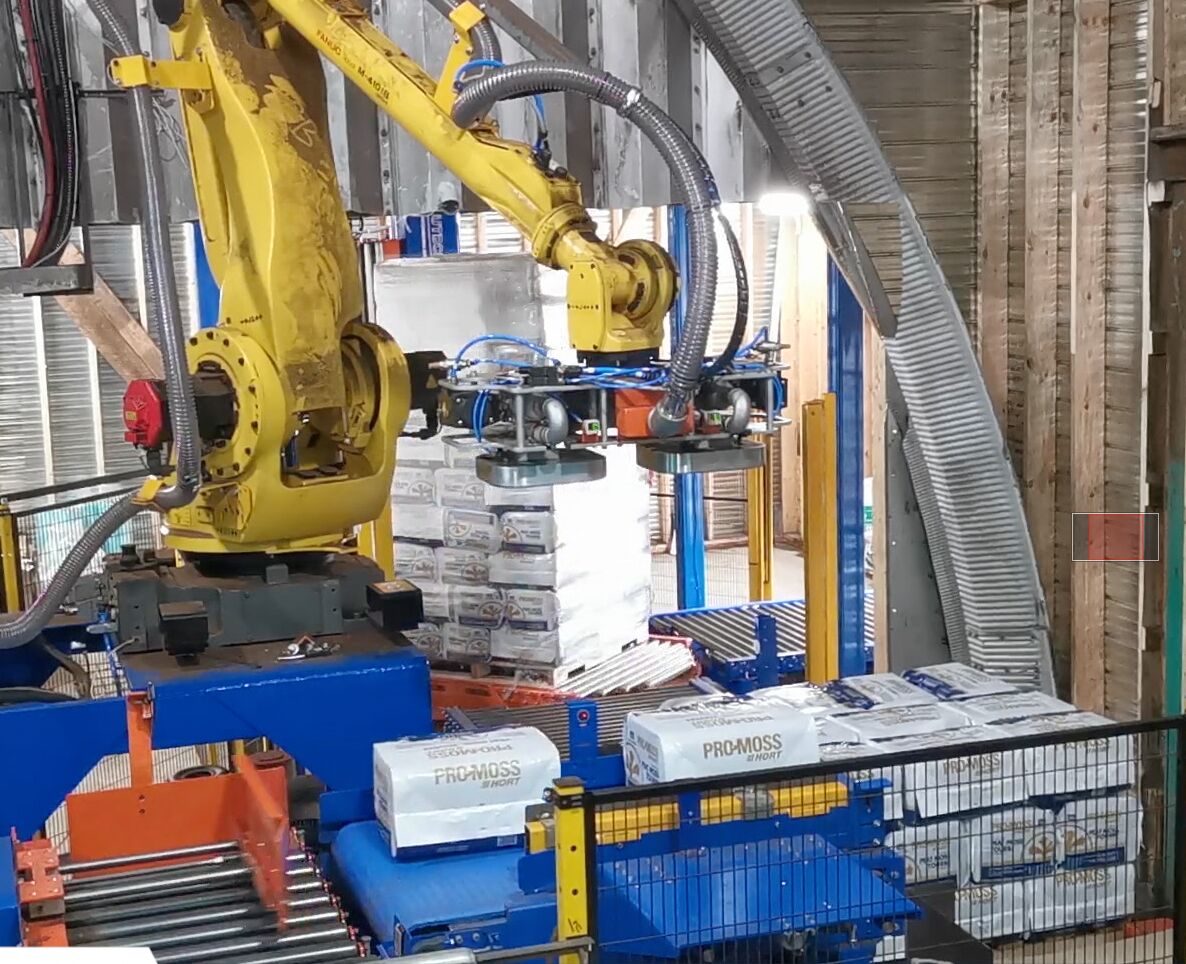 Cellule robotisée intégrée avec banderoleuse